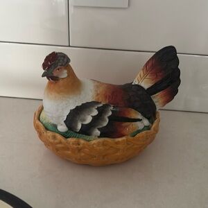 Staffordshire hen on a nest